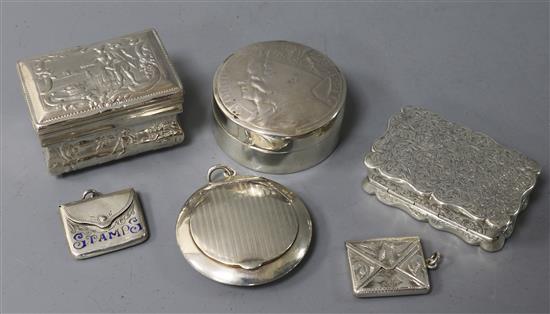 Two early 20th century silver stamp envelopes including enamel, an Edwardian snuff box, two others and a compact.